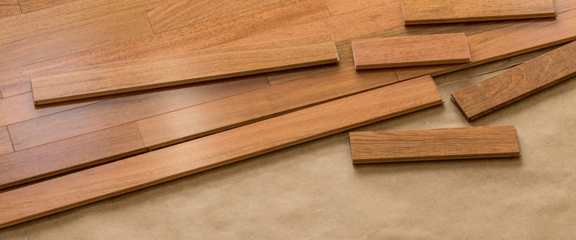 What are the primary advantages of engineered wood floors over solid wood?