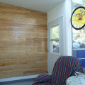 Can hardwood flooring be used on walls?